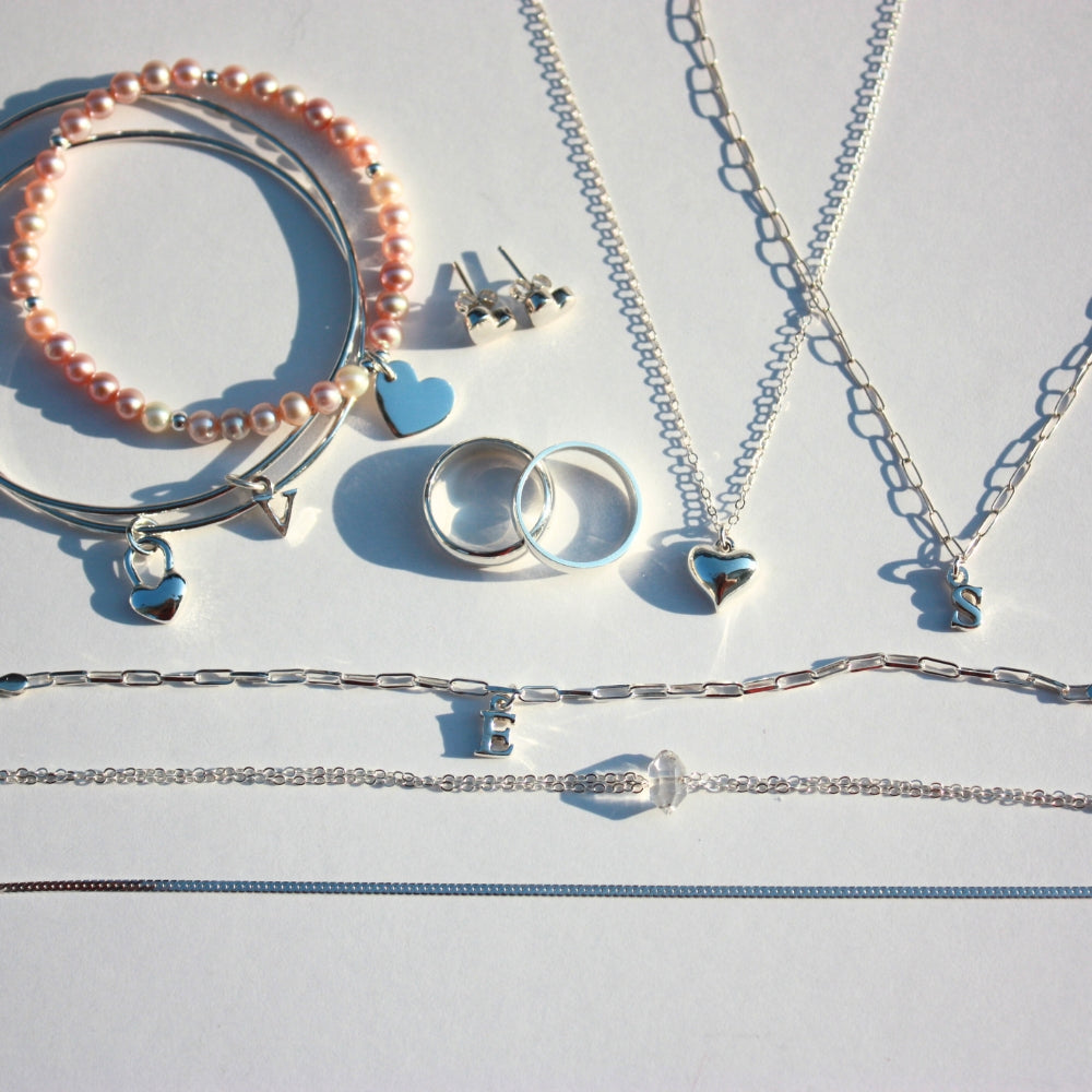 Joyful and Co handcrafted sterling silver and fine silver necklaces, rings, earrings, and bracelets collection.