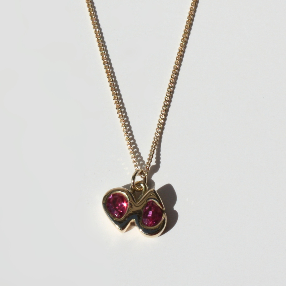 "14k gold double pear fuchsia gemstone pendant shown on both 14k gold paperclip and curb chains."