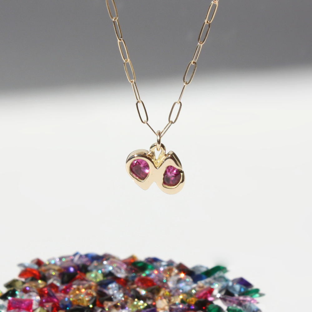 "Joyful and Co solid 14k gold double pear fuchsia gemstone pendant necklace on a 14k gold paperclip chain."