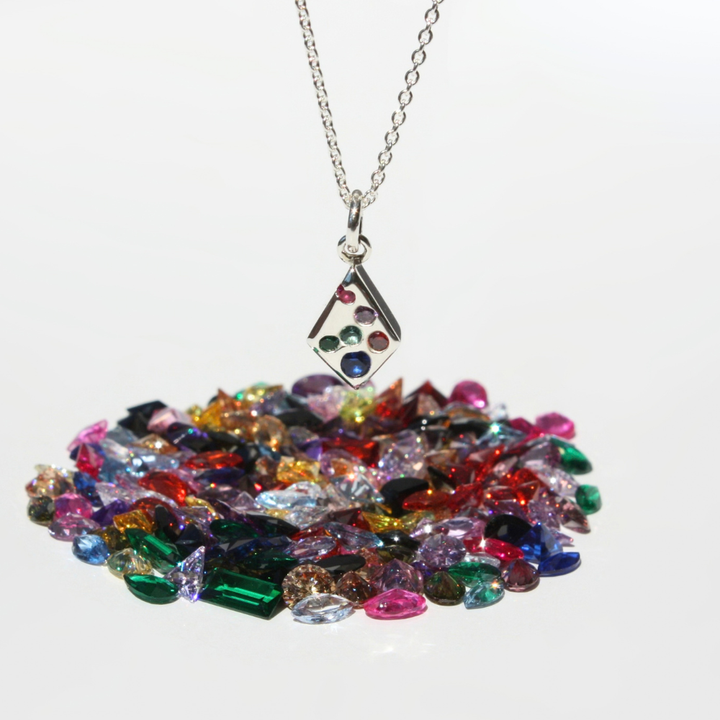 "Joyful and Co .999 fine silver sand cast kite gemstone pendant on a sterling silver cable chain."