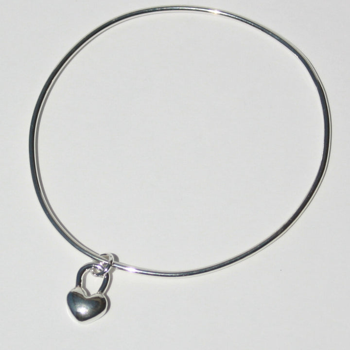 Joyful and Co handcrafted sterling silver heart charm bangle bracelet with pure fine silver metal clay charm.