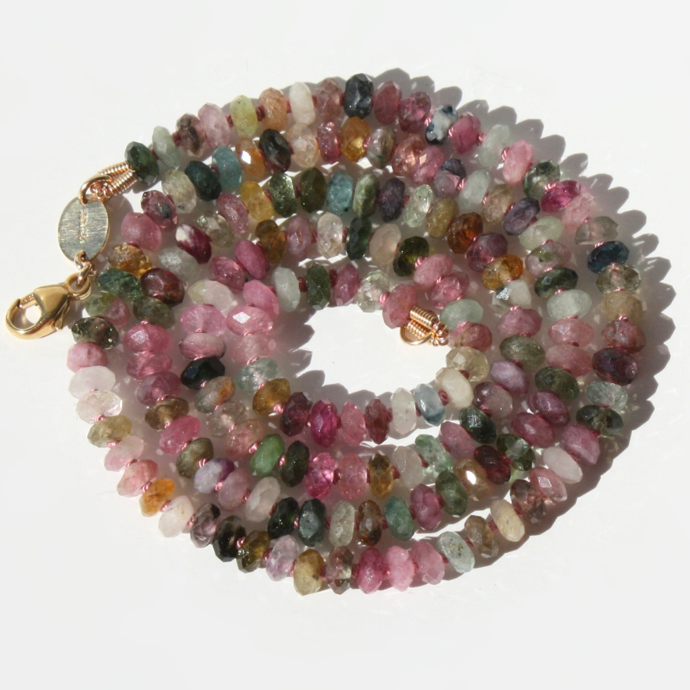 "Joyful and Co watermelon tourmaline faceted rondelle beaded necklace hand-knotted in silk with gold clasp."