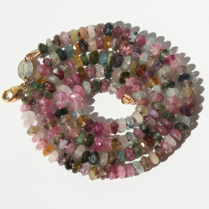"Joyful and Co watermelon tourmaline faceted rondelle beaded necklace hand-knotted in silk with gold clasp."