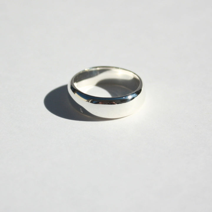 "Joyful and Co .925 sterling silver wide sand cast organic ring band."