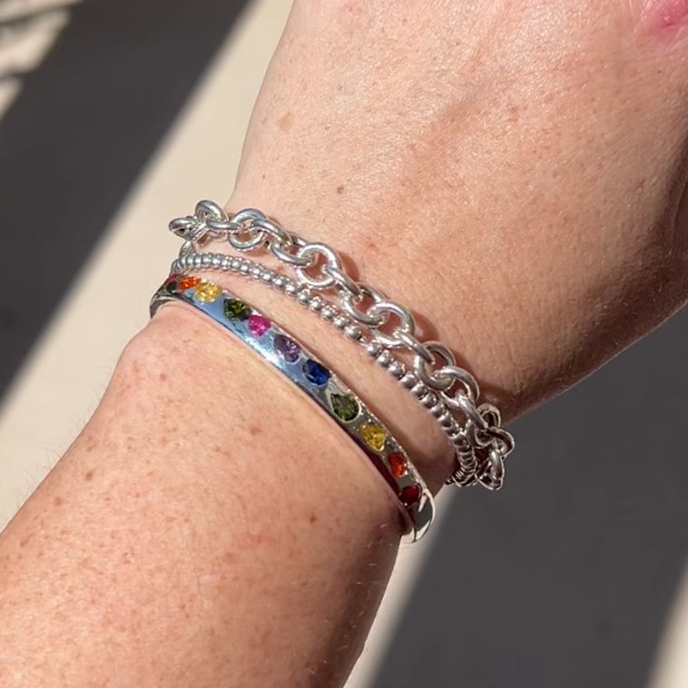 Video Of a model wearing a Sterling Silver Rainbow Gemstone Cuff.